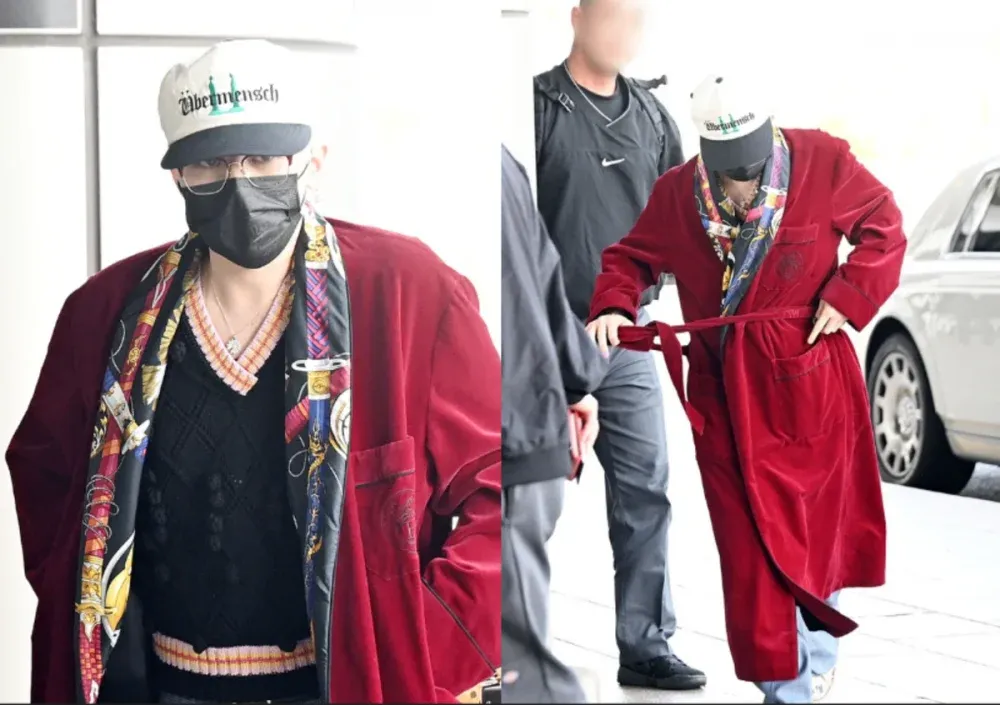 G-Dragon穿着浴袍以大胆的机场造型吸引了人们的注意